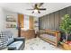 Stylish Bedroom featuring a wooden crib, modern accent wall, chair, and eclectic decor for a cozy and inviting space at 3270 Courtland Blvd, Deltona, FL 32738
