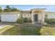 Charming single-story home with a well-manicured lawn, and a welcoming entryway at 3270 Courtland Blvd, Deltona, FL 32738