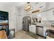 Functional kitchen area with laundry, featuring modern stainless steel appliances, and a view to the exterior at 3270 Courtland Blvd, Deltona, FL 32738