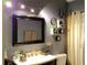 Well-lit bathroom with a large mirror, modern vanity, updated lighting, and neutral paint at 3312 Bridgeford Dr, Orlando, FL 32812