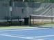 Community tennis court featuring green bench and dark green fence at 3312 Bridgeford Dr, Orlando, FL 32812