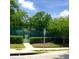 Community tennis court with mature landscaping at 3312 Bridgeford Dr, Orlando, FL 32812