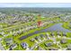 High aerial shot of neighborhood featuring lakes, green spaces, and residential streets at 356 Quarry Rock Cir, Kissimmee, FL 34758