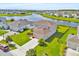 Aerial view of home near a beautiful lake and neighborhood amenities with well maintained yard at 356 Quarry Rock Cir, Kissimmee, FL 34758