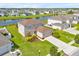 An aerial of a well-kept house, showcasing landscaping, in a neighborhood with pond views at 356 Quarry Rock Cir, Kissimmee, FL 34758
