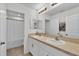 Bright bathroom featuring double sinks, white cabinetry, and a shower/tub combination at 356 Quarry Rock Cir, Kissimmee, FL 34758