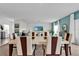Dining area with modern decor open to a living room, great for entertaining guests and Gathering at 356 Quarry Rock Cir, Kissimmee, FL 34758