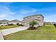 Two-story home with a well-kept lawn, a two-car garage, and a clean driveway on a sunny day at 356 Quarry Rock Cir, Kissimmee, FL 34758