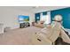 Spacious living room with reclining leather seating and modern decor at 356 Quarry Rock Cir, Kissimmee, FL 34758