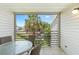 Enjoy outdoor dining on your private balcony with scenic views at 3900 Southpointe Dr # 127, Orlando, FL 32822