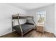 Bedroom with a bunkbed, wood floors, and natural light at 3900 Southpointe Dr # 127, Orlando, FL 32822