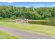 Welcoming entrance to the Ventura community with lush landscaping and pond at 3900 Southpointe Dr # 127, Orlando, FL 32822