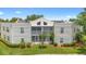 Charming condo featuring a screened porch and manicured lawn, perfect for relaxing outdoors at 3900 Southpointe Dr # 127, Orlando, FL 32822