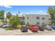 This is an exterior view of the condo building, showcasing ample parking at 3900 Southpointe Dr # 127, Orlando, FL 32822