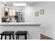Efficient kitchen design with stainless steel appliances and breakfast bar at 3900 Southpointe Dr # 127, Orlando, FL 32822