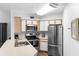 Bright kitchen featuring stainless steel appliances and ample counter space at 3900 Southpointe Dr # 127, Orlando, FL 32822