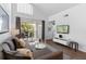 Bright living area with balcony, stylish sofa and a wall-mounted TV for entertainment at 3900 Southpointe Dr # 127, Orlando, FL 32822