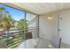 This screened patio features a glass table and comfortable chairs, perfect for enjoying the outdoors at 3900 Southpointe Dr # 127, Orlando, FL 32822