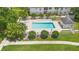 An aerial view displays the community pool and lounge area, perfect for relaxation at 3900 Southpointe Dr # 127, Orlando, FL 32822