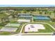 An aerial shot highlights the community's recreational facilities, including tennis and play courts at 3900 Southpointe Dr # 127, Orlando, FL 32822