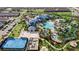 Aerial view showcases resort-style pool, beach volleyball, playground, and community amenities at 4314 Lana Ave, Davenport, FL 33897
