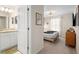 Cozy bedroom with a neutral palette, carpeted floors, and abundant natural light. Door to Ensuite Bathroom at 4314 Lana Ave, Davenport, FL 33897