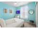 Bright bedroom with blue walls, a TV, and comfortable bedding at 4314 Lana Ave, Davenport, FL 33897