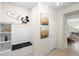 Bright foyer features stylish built-in storage, unique lighting, and decorative wall art at 4314 Lana Ave, Davenport, FL 33897