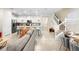 Open-concept kitchen flows into living area with staircase and comfortable seating at 4314 Lana Ave, Davenport, FL 33897