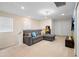 Bright and cozy loft with gaming setup and comfortable gray sectional sofa at 4314 Lana Ave, Davenport, FL 33897