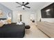 Serene bedroom with king bed, sleek decor, and view into ensuite bathroom at 4314 Lana Ave, Davenport, FL 33897