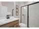 Clean bathroom featuring a modern shower with glass doors and stylish fixtures at 4564 Maple Waltz Aly, Clermont, FL 34714
