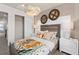 Bedroom with decorative hanging baskets over the bed with a fun tiger themed bedspread and pillows at 4564 Maple Waltz Aly, Clermont, FL 34714