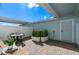 Charming brick patio with outdoor seating, planters, and a bright blue exterior at 4564 Maple Waltz Aly, Clermont, FL 34714