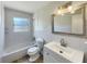 Clean bathroom with a tub-shower combo, white vanity, and updated fixtures at 472 Little Aspen Ct, Ocoee, FL 34761