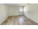 Bright room with neutral walls, modern flooring, and a window providing natural light at 472 Little Aspen Ct, Ocoee, FL 34761