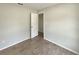 A standard bedroom with light gray walls and wooden floors, and bright natural light at 472 Little Aspen Ct, Ocoee, FL 34761