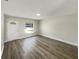Bright living room featuring a large window, neutral paint, and modern flooring at 472 Little Aspen Ct, Ocoee, FL 34761
