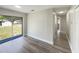 Bright room with modern flooring, neutral paint, and a sliding glass door for natural light at 472 Little Aspen Ct, Ocoee, FL 34761