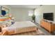 Comfortable bedroom with a queen-sized bed, modern decor, and a serene ambiance at 472 Little Aspen Ct, Ocoee, FL 34761