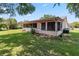 Screened-in porch on the back of the home, overlooking the well-maintained lawn at 4930 Gifford Blvd, Orlando, FL 32821