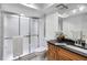 Updated bathroom featuring a glass-enclosed shower and a modern vanity at 4930 Gifford Blvd, Orlando, FL 32821