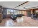 Versatile bonus room with wood paneled walls, tile flooring, ceiling fan, and plenty of space at 4930 Gifford Blvd, Orlando, FL 32821