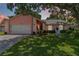 Charming single-Gathering home with a well-maintained lawn, mature trees, and inviting curb appeal at 4930 Gifford Blvd, Orlando, FL 32821