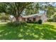 Well-maintained home with a green lawn and shade trees at 4930 Gifford Blvd, Orlando, FL 32821