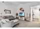 Bright living room featuring a comfortable sofa, vaulted ceilings, and plenty of space for entertaining at 4930 Gifford Blvd, Orlando, FL 32821