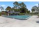 Community swimming pool with ample seating and shade for residents to enjoy at 4930 Gifford Blvd, Orlando, FL 32821