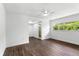 Bright bedroom features dark wood floors, a ceiling fan, and a large window with lots of natural light at 611 Lakespur Ln, Altamonte Springs, FL 32714