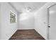 Cozy bedroom with wood floors, a window, and a ceiling fan at 611 Lakespur Ln, Altamonte Springs, FL 32714