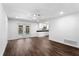 Open living area with wood floors, ceiling fan, and sliding doors to the pool at 611 Lakespur Ln, Altamonte Springs, FL 32714